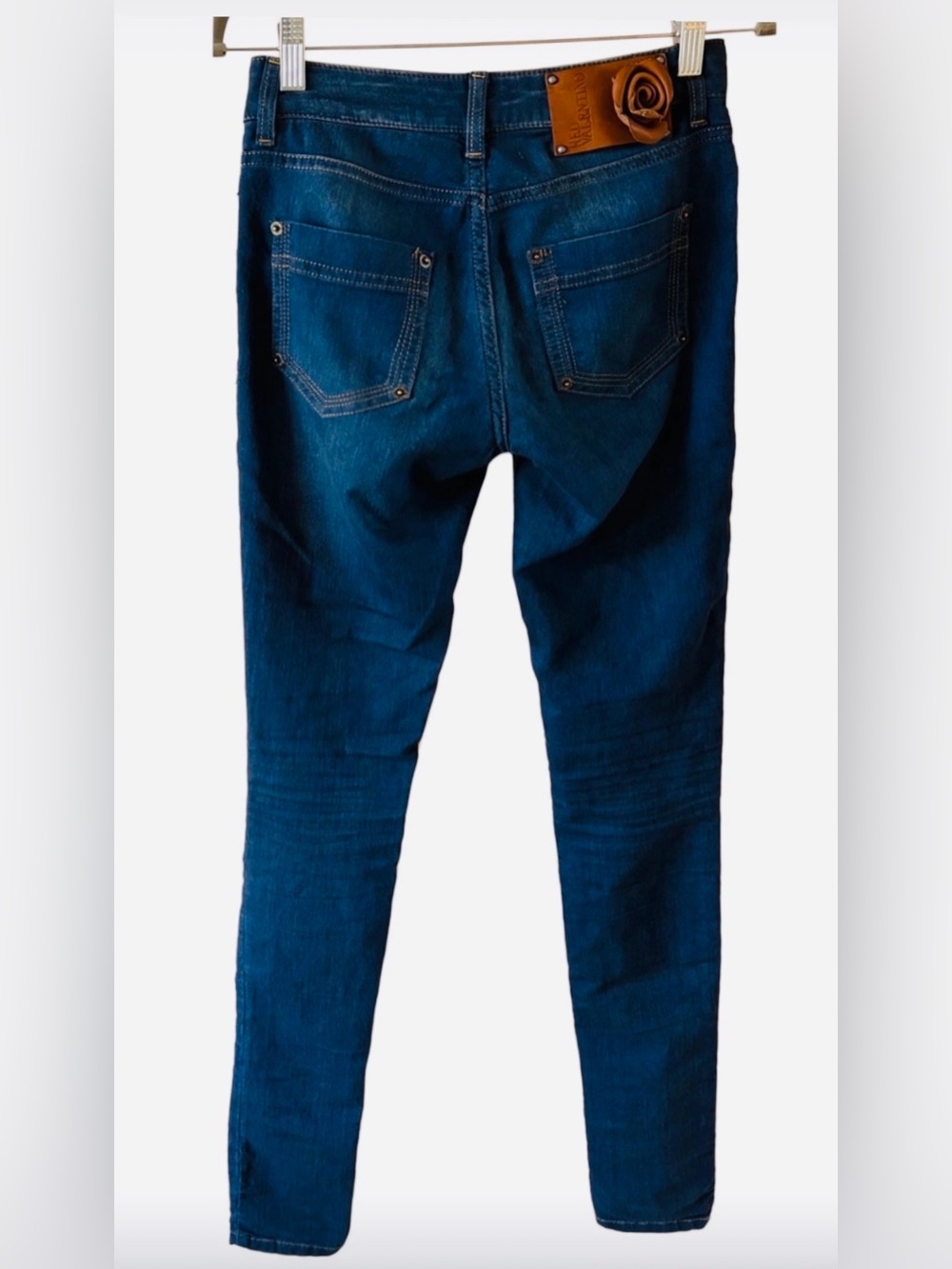 Red Valentino dark blue skinny jeans back brown leather rose label. Fits size 24